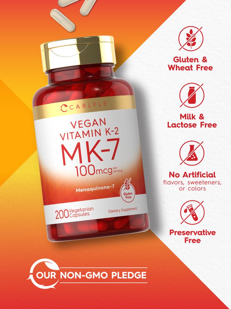 Red vegetarian capsules of Carlyle Vegan Vitamin K-2 MK-7, 100mcg per serving, 200 count, displayed on a hand scale.