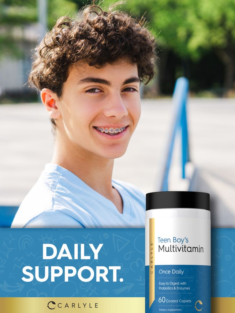 A teen boy smiles at the camera outdoors, next to a Teen Boy's Multivitamin bottle.