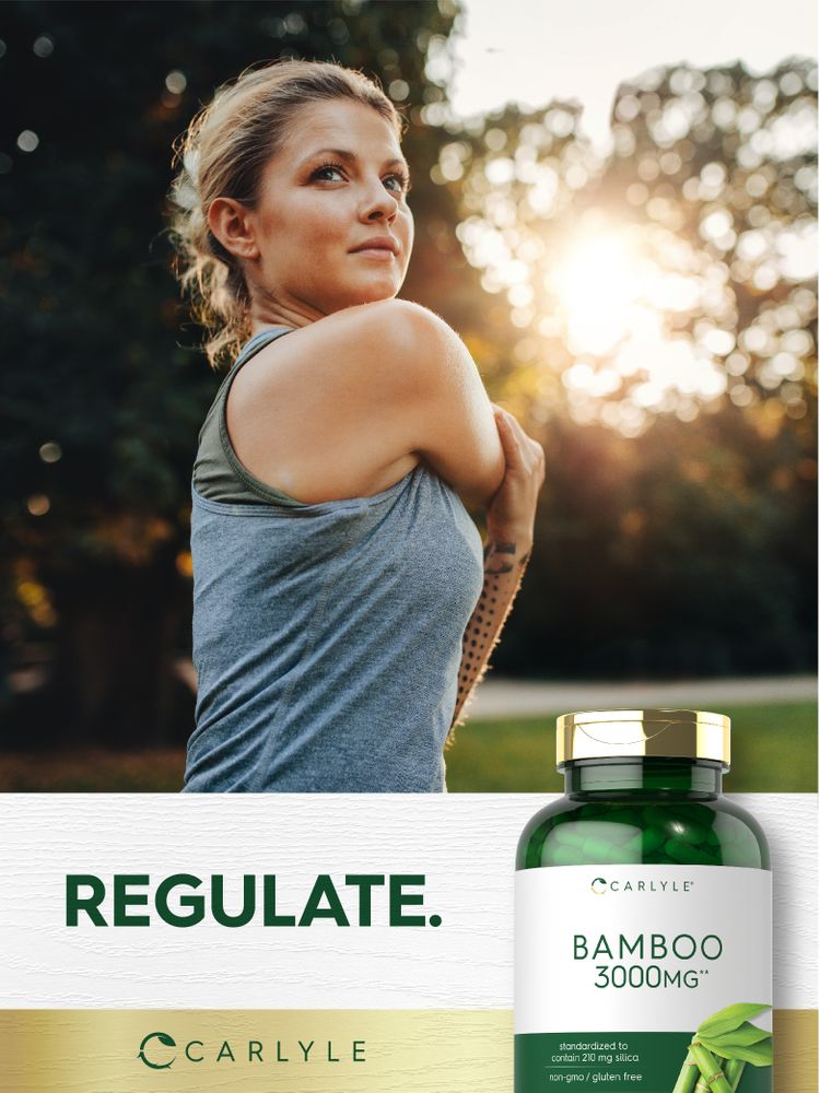 Woman in her 30s or 40s stretches outdoors with a Carlyle Bamboo bottle.