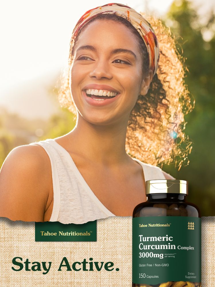 A young woman smiling outdoors next to a bottle of Turmeric Curcumin Complex.