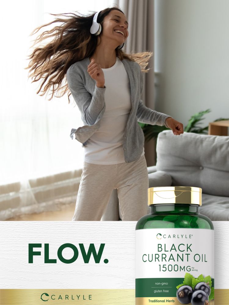 A young woman happily dancing with headphones on, hair flowing, next to a Black Currant Oil bottle.