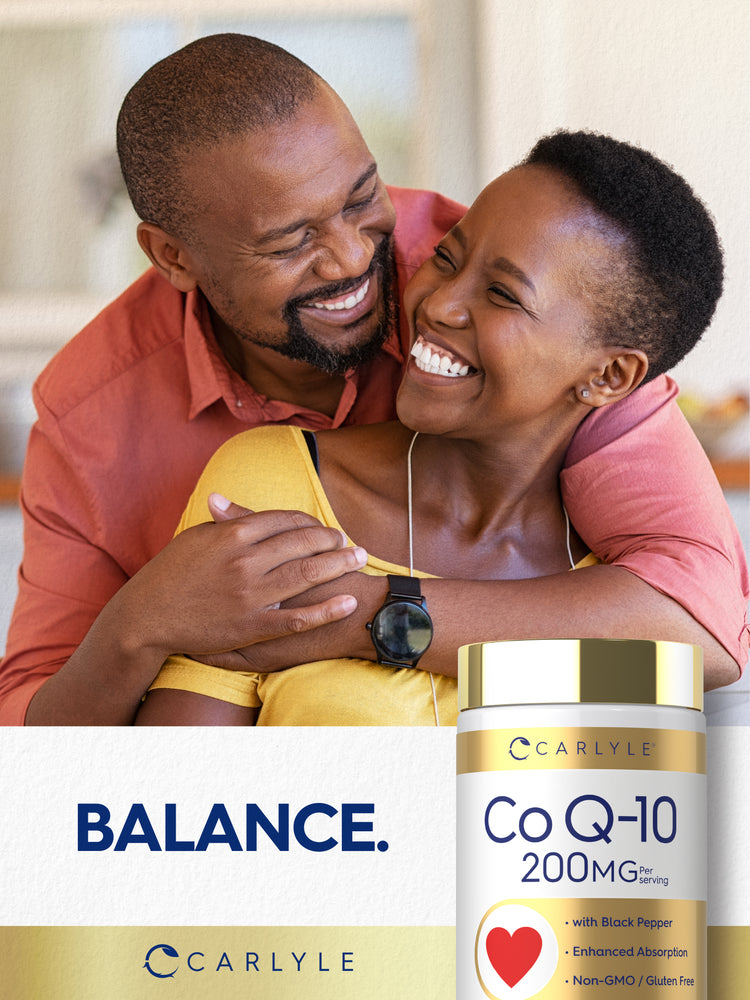 A Black couple hugging and laughing, a Carlyle Co Q-10 bottle is in the foreground.