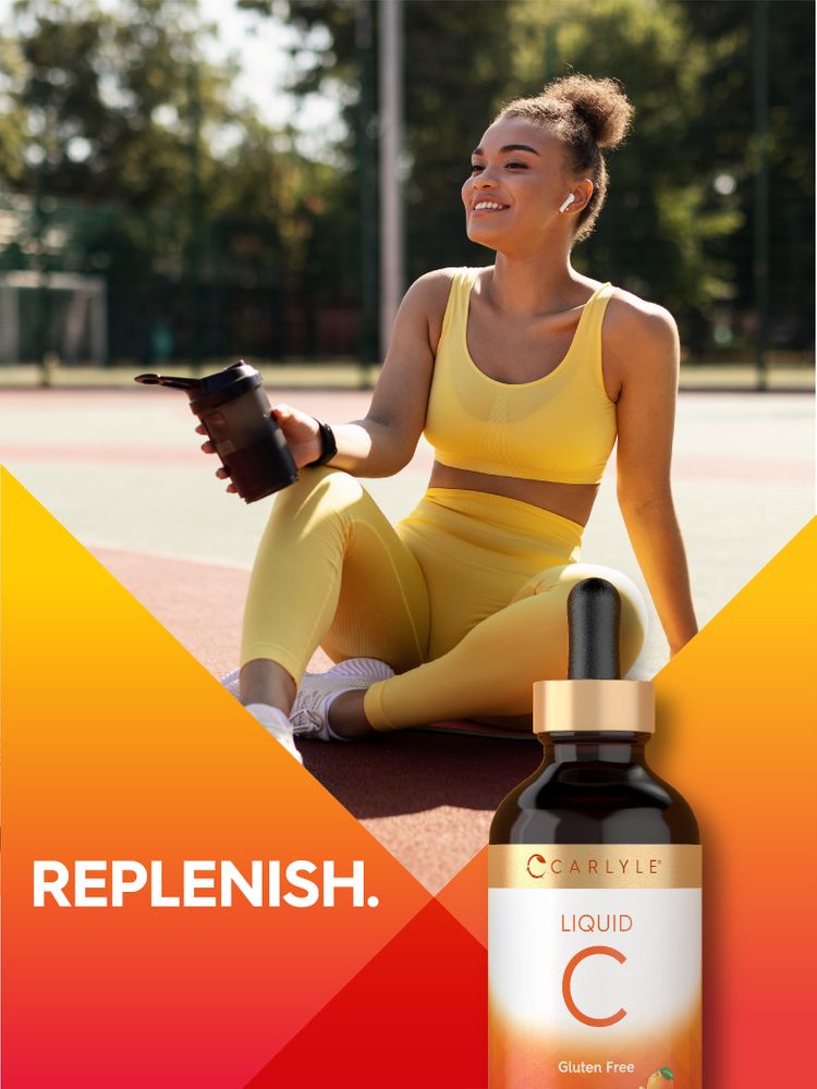 A 4 fl oz bottle of Carlyle Vitamin C Liquid on a hand scale, showing the product's size for convenient measurement.