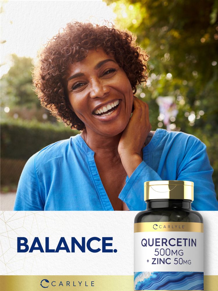 Middle-aged African American woman smiling outdoors next to a Carlyle Quercetin 500mg + Zinc 50mg bottle.