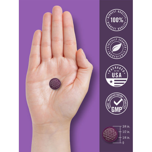 View 7 Melatonin gummy held in hand with a ruler showing its diameter is about 1/2 inch.