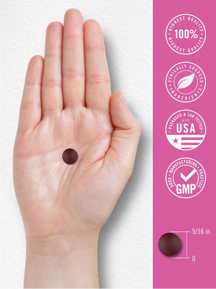 A hand holds a round dark red tablet, measuring 5/16 inches.