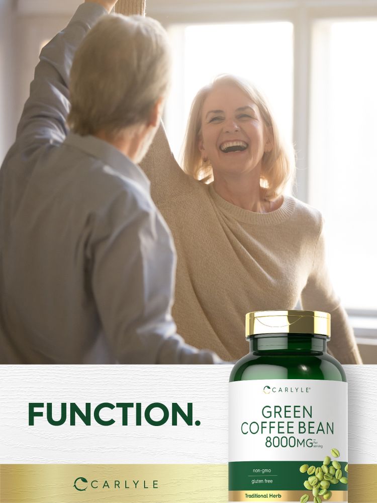 An older man and woman laugh and raise their arms with a Carlyle Green Coffee Bean bottle.