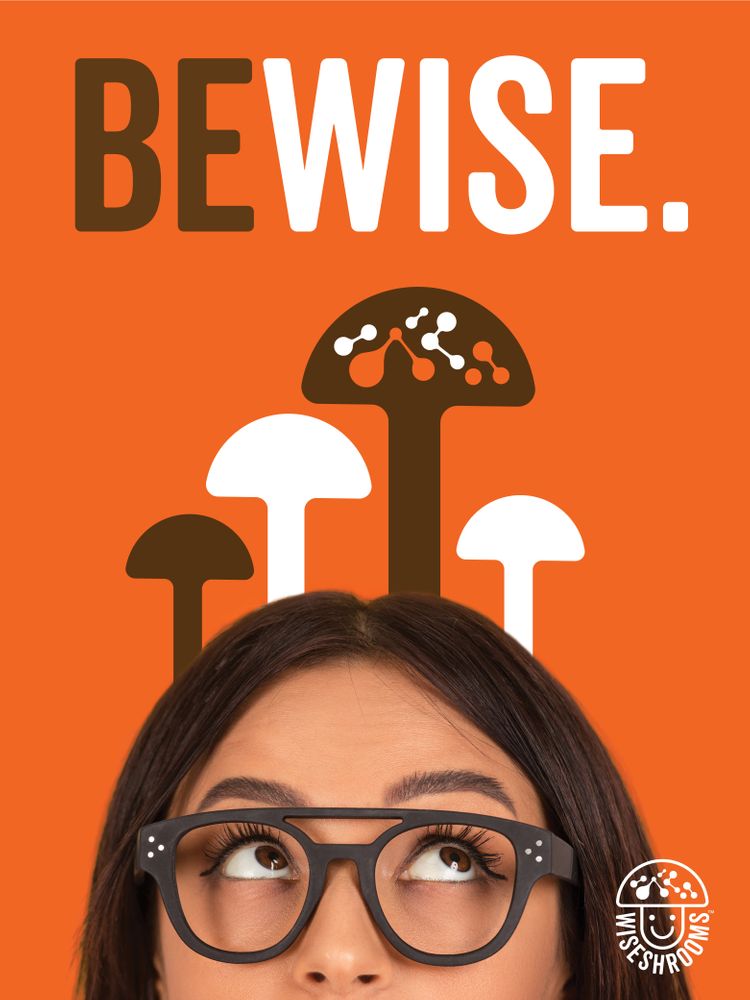 'BE WISE.' text above stylized brown and white mushrooms, with a woman in glasses looking up. WiseShrooms logo at bottom right.