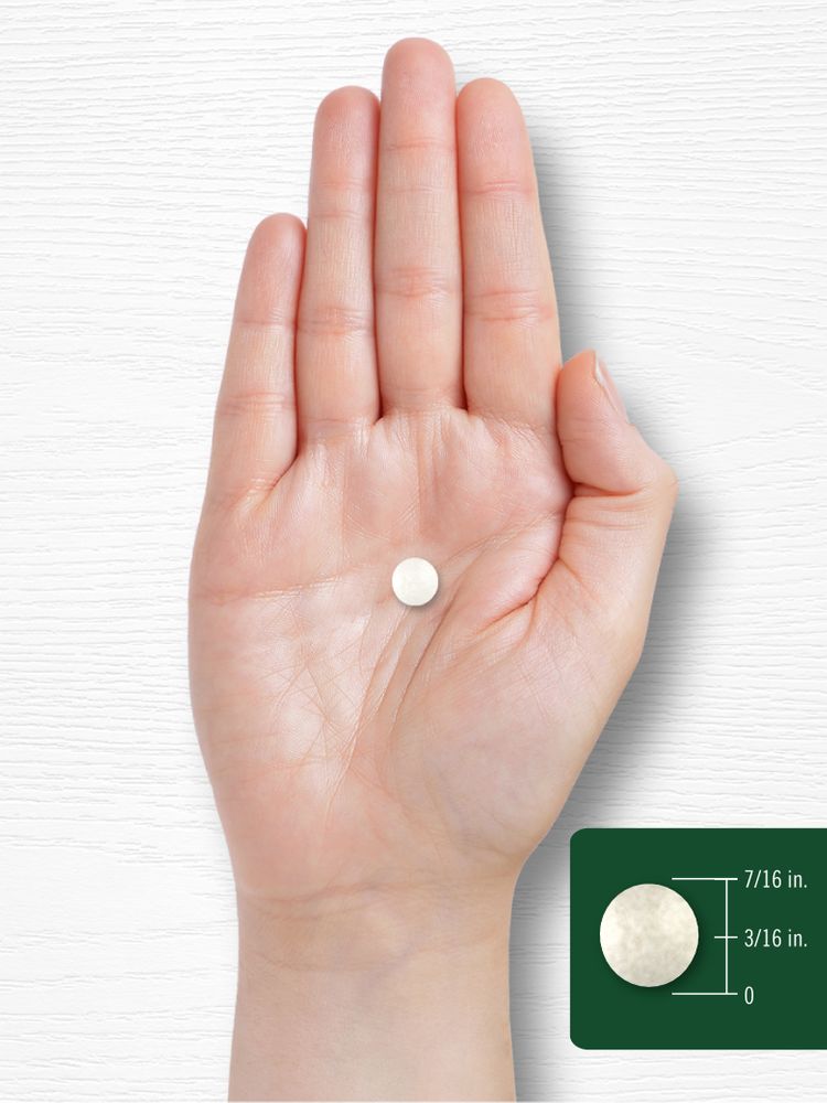 A round, chewable Vitamin C tablet measuring 7/16 inches in diameter and 3/16 inches in thickness.