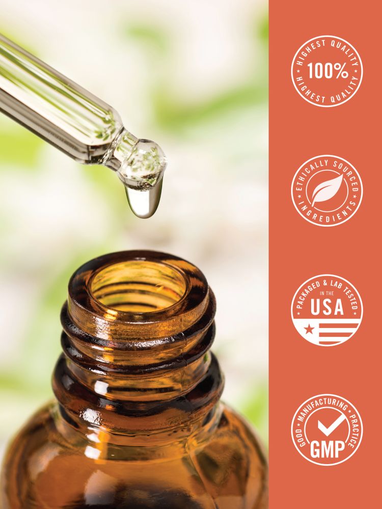 A single drop of clear liquid iodine falls from a glass dropper into an amber bottle.