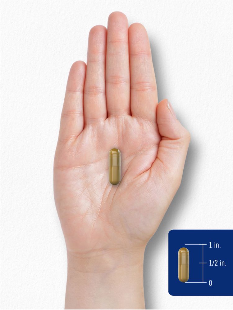A small 1-inch capsule is displayed on a person's hand, highlighting its compact size for easy consumption.