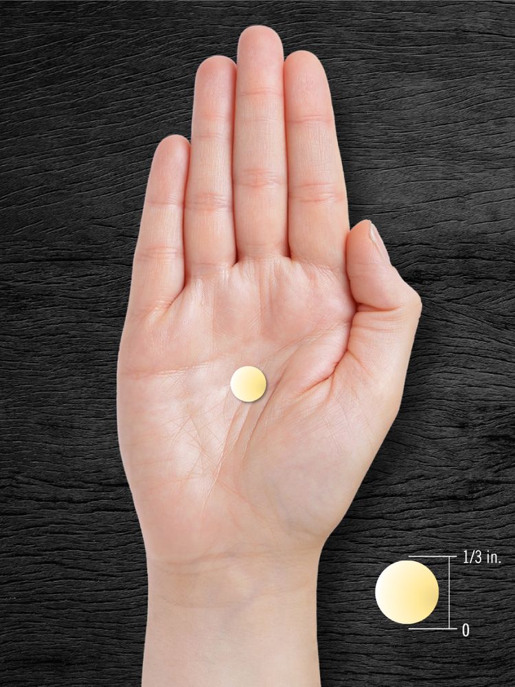 A single coated caplet, about 1/3 inch in diameter, is placed on an open palm for size comparison.