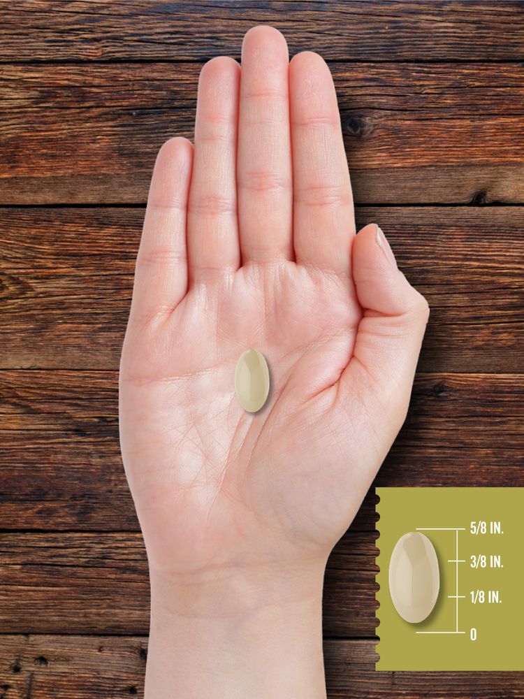 A hand holding a 5/8 inch oval softgel.