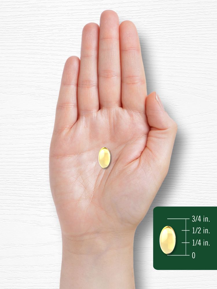 A softgel capsule measuring half an inch is shown on a hand-held scale, illustrating size and quantity in bulk form.