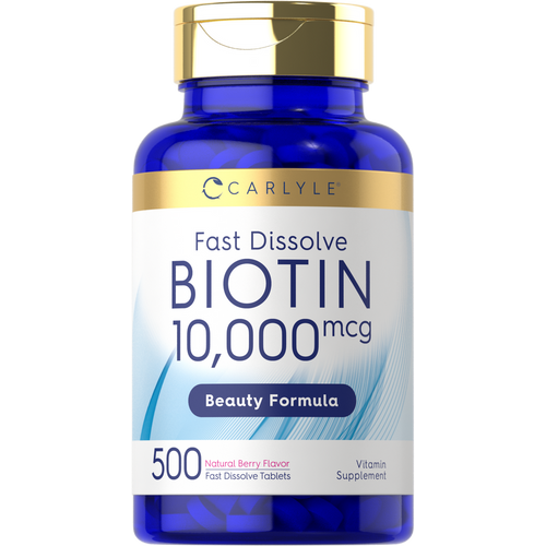 View 1 A hand holds a bottle labeled Biotin 10,000mcg with 500 fast-dissolve tablets, designed for quick absorption and nutritional support.