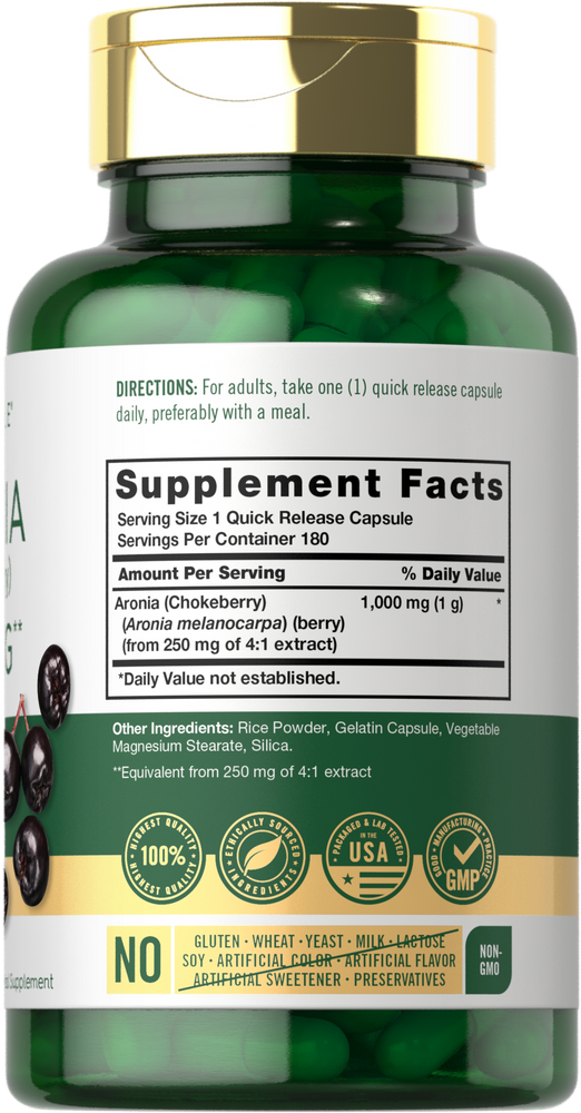 A hand holding a bottle of Aronia (Chokeberry) 1000 mg capsules.