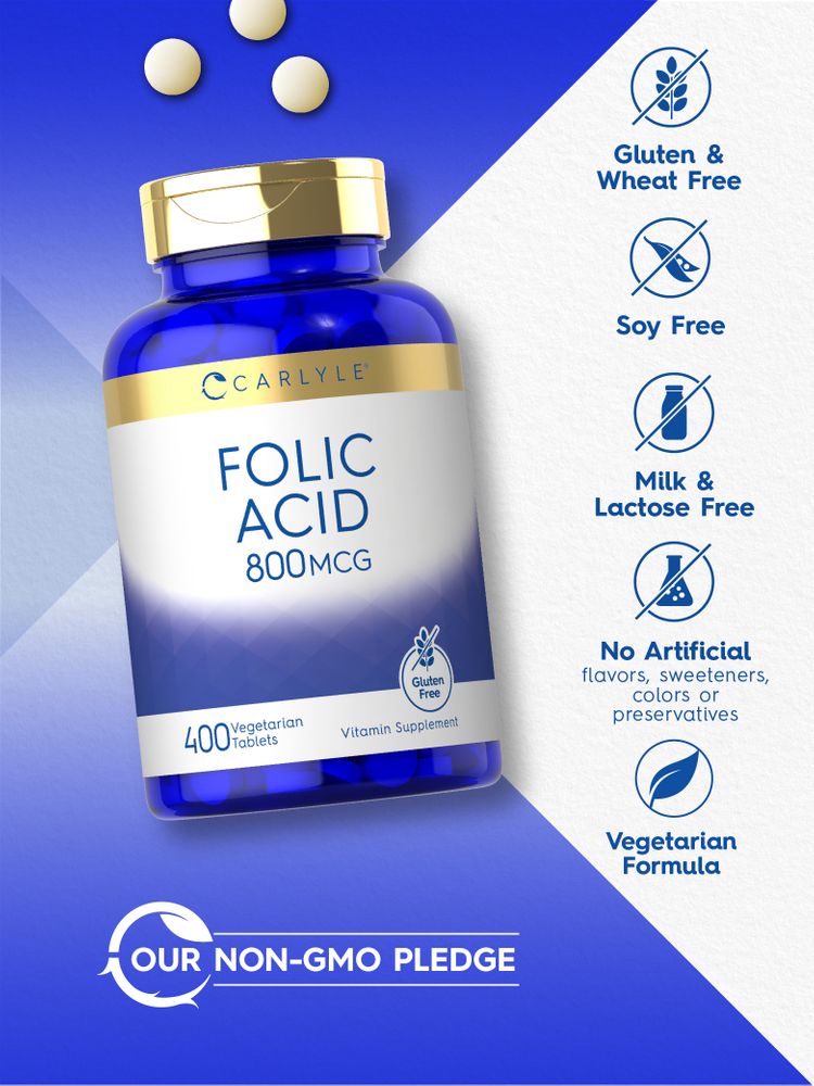 A hand holds a scale with three round, white Folic Acid 800 mcg tablets.