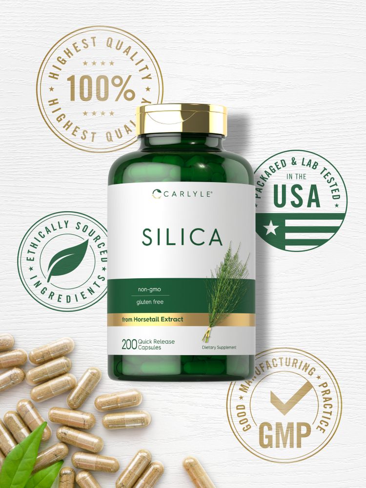 Translucent brown silica 500 mg capsules filled with powder are scattered on a white surface.