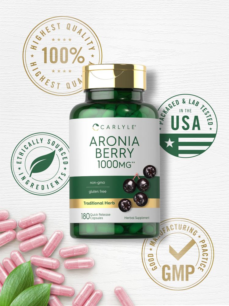 Hand holding a bulk scale with Pink Aronia Berry 1000mg quick release capsules, illustrating the product's quantity and ease of use.