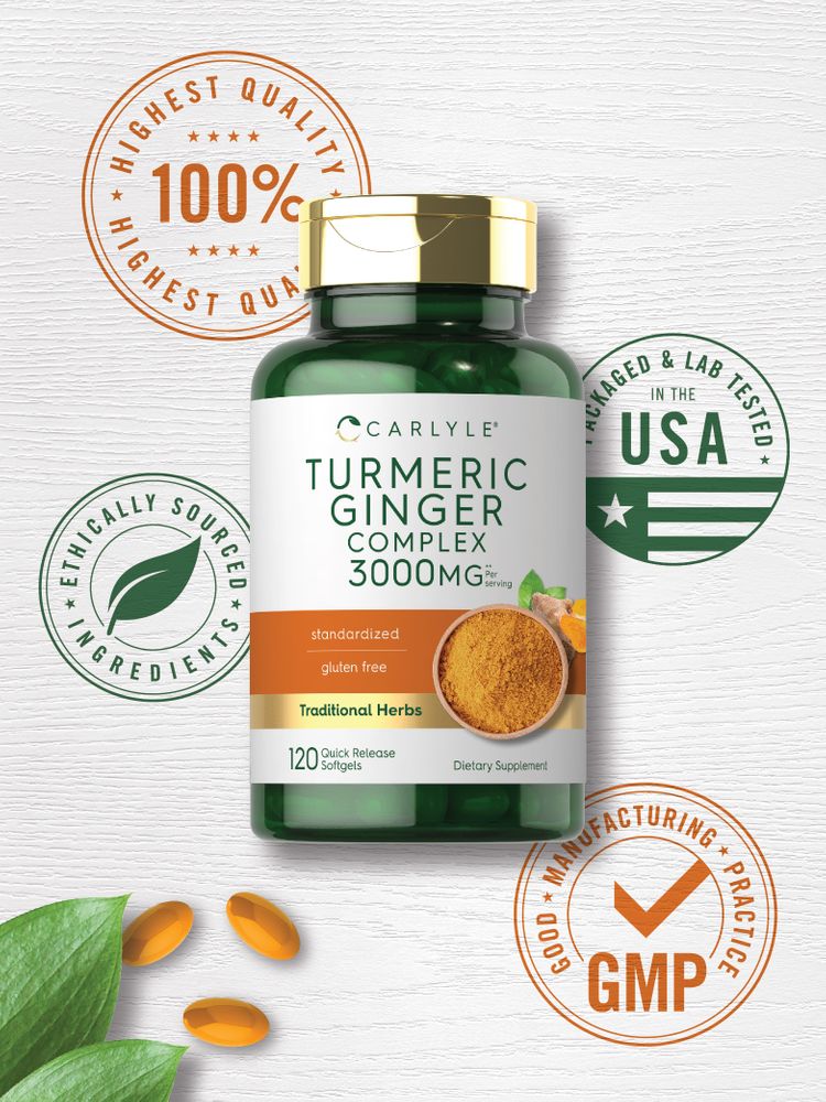 Orange quick release softgels arranged with green leaves, ginger root, and turmeric powder.