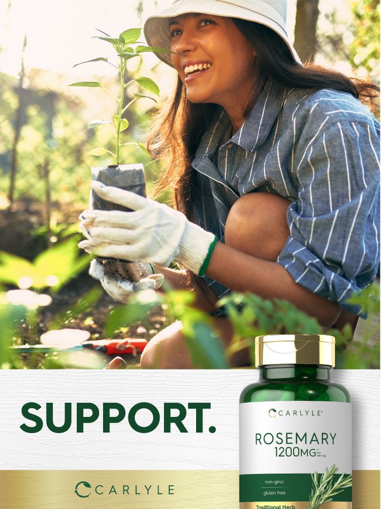 Young woman kneels in a garden, planting a seedling and smiling, with a Carlyle Rosemary bottle nearby.