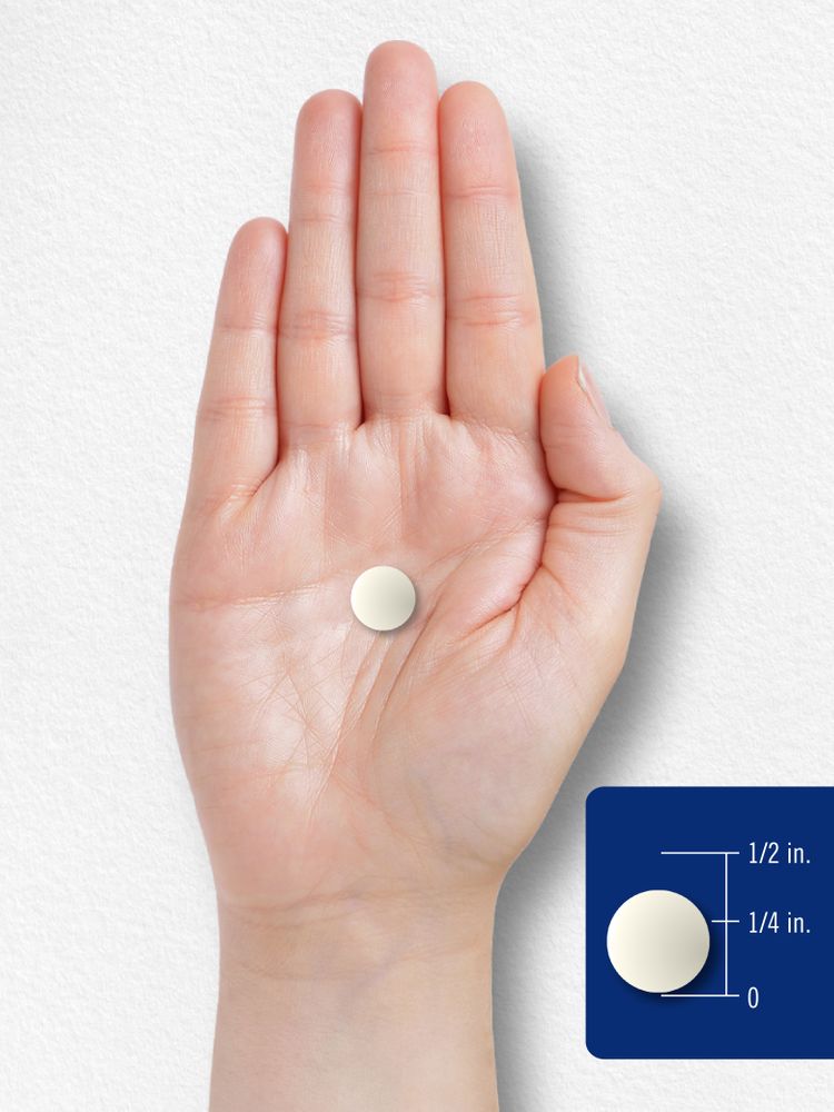 A 1/4 inch tablet displayed on a hand scale.
