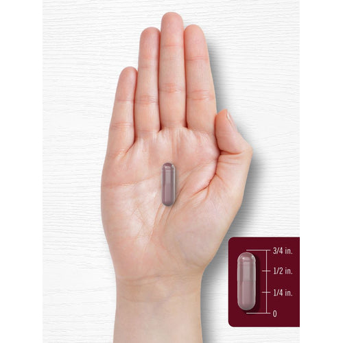 View 7 A hand holds a single capsule measuring 3/4 inch.