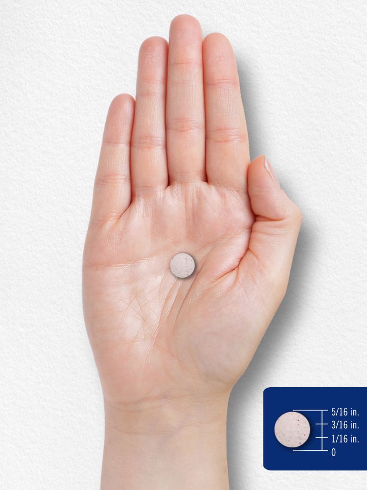 Image of a hand holding a scale displaying a tablet with a 5/16 inch diameter.